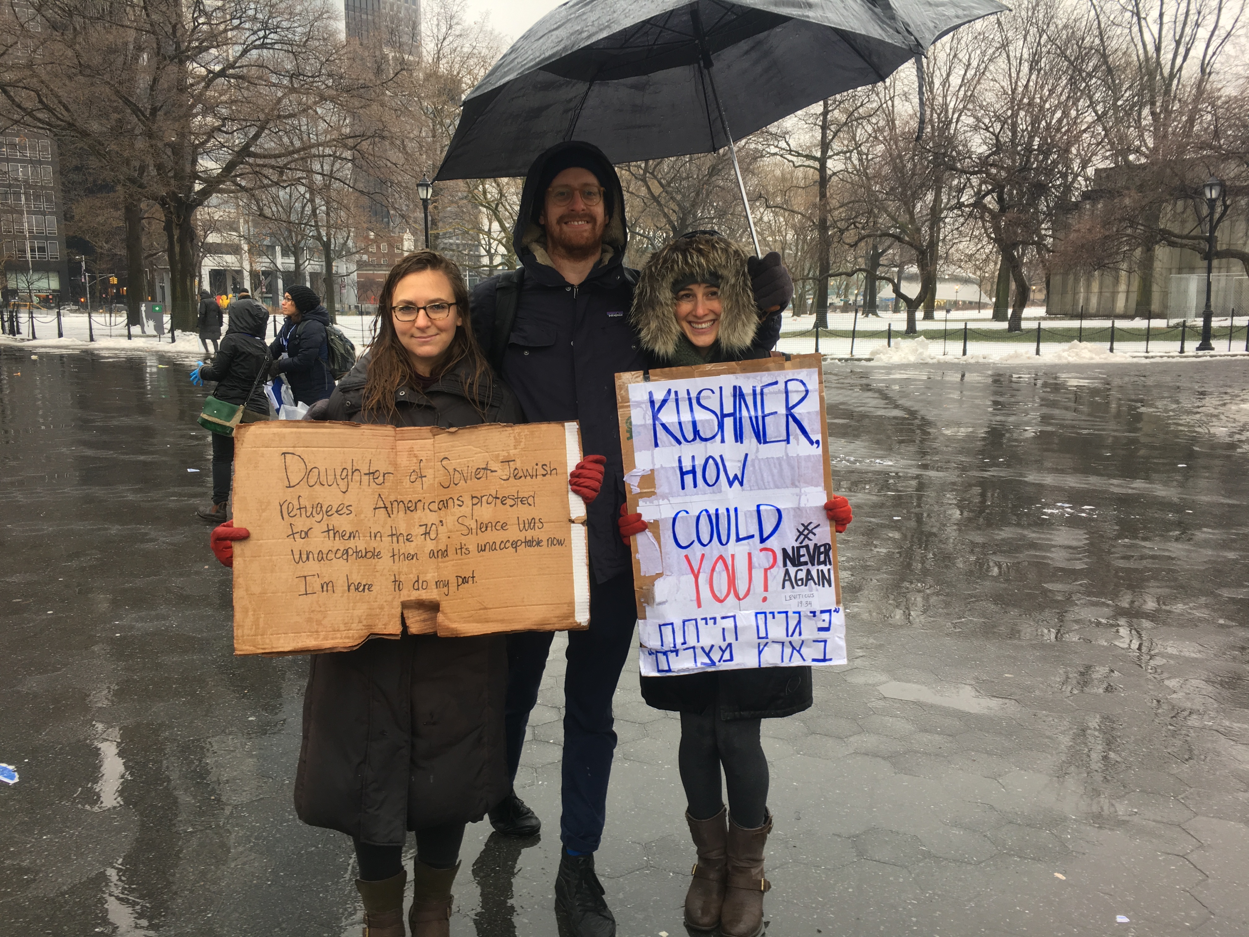 Elianna Kan, left, said the fact that her family members came to the U.S. as refugees from the Soviet Union motivated her to attend the New York City rally with her friends Will Hunt and Sarah Rosen. (Josefin Dolsten)