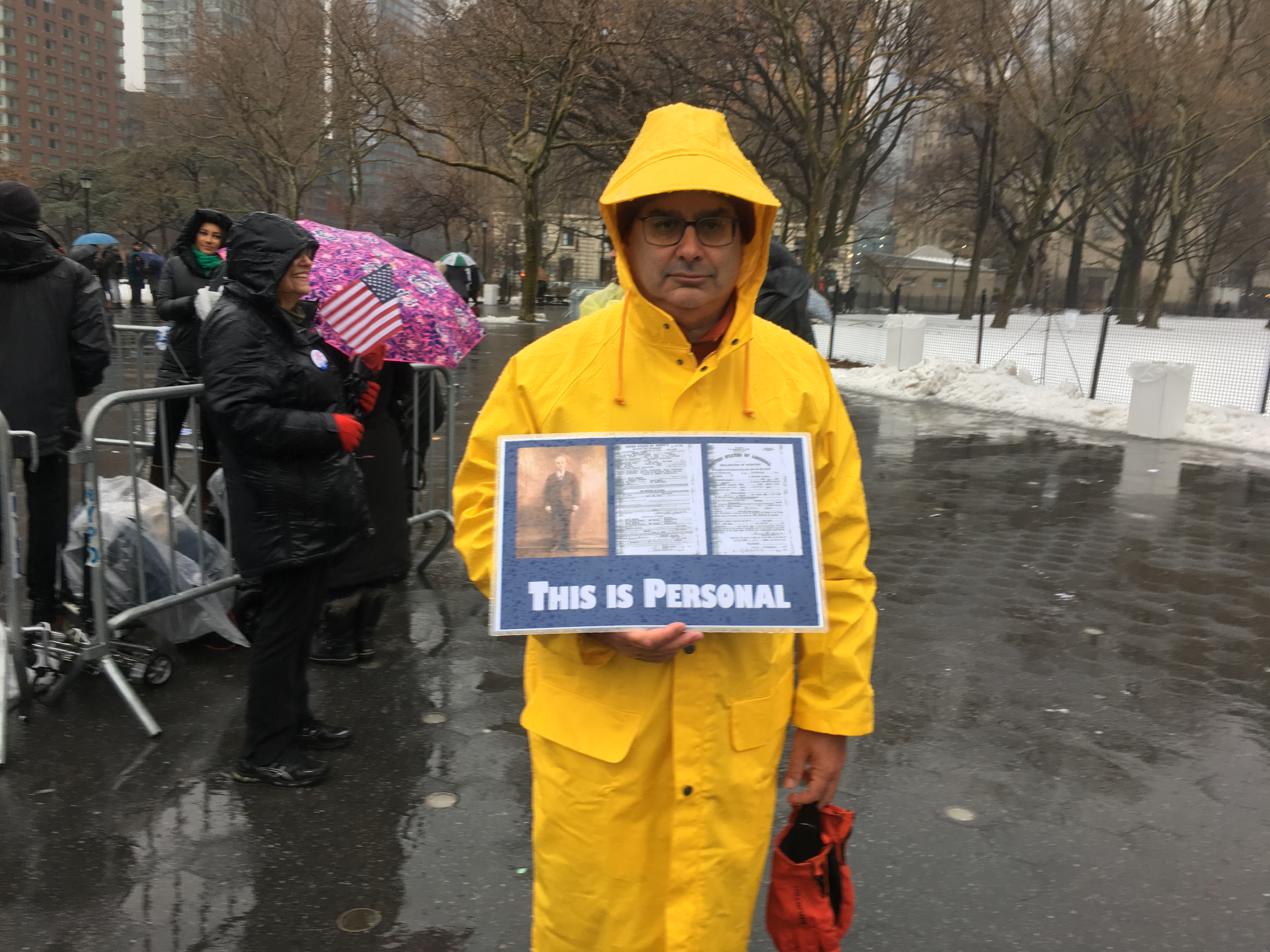 Harold Levine brought a poster to the New York City rally showing his grandfather, who immigrated to the United States over 100 years ago, fleeing anti-Semitism in his native Poland. (Josefin Dolsten)