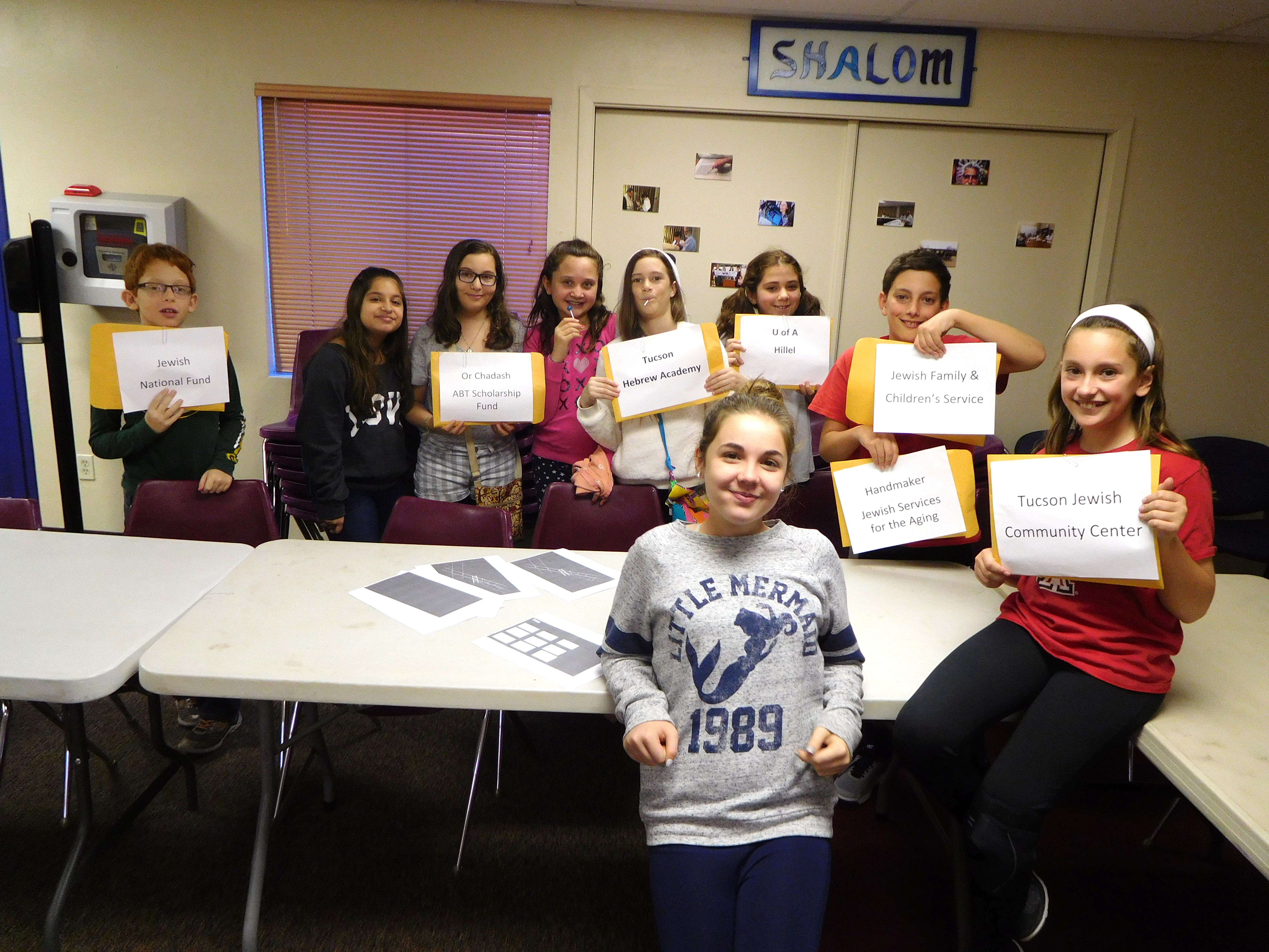 L-R: Or Chadash sixth graders David Berk, Gabby Marsh (visitor), Talya Fleisher, Emma Ruben, Lily Goldberg, Jessica Witchey, Ethan Silvyn, Riley Silvyn. Center: Ava Silverman