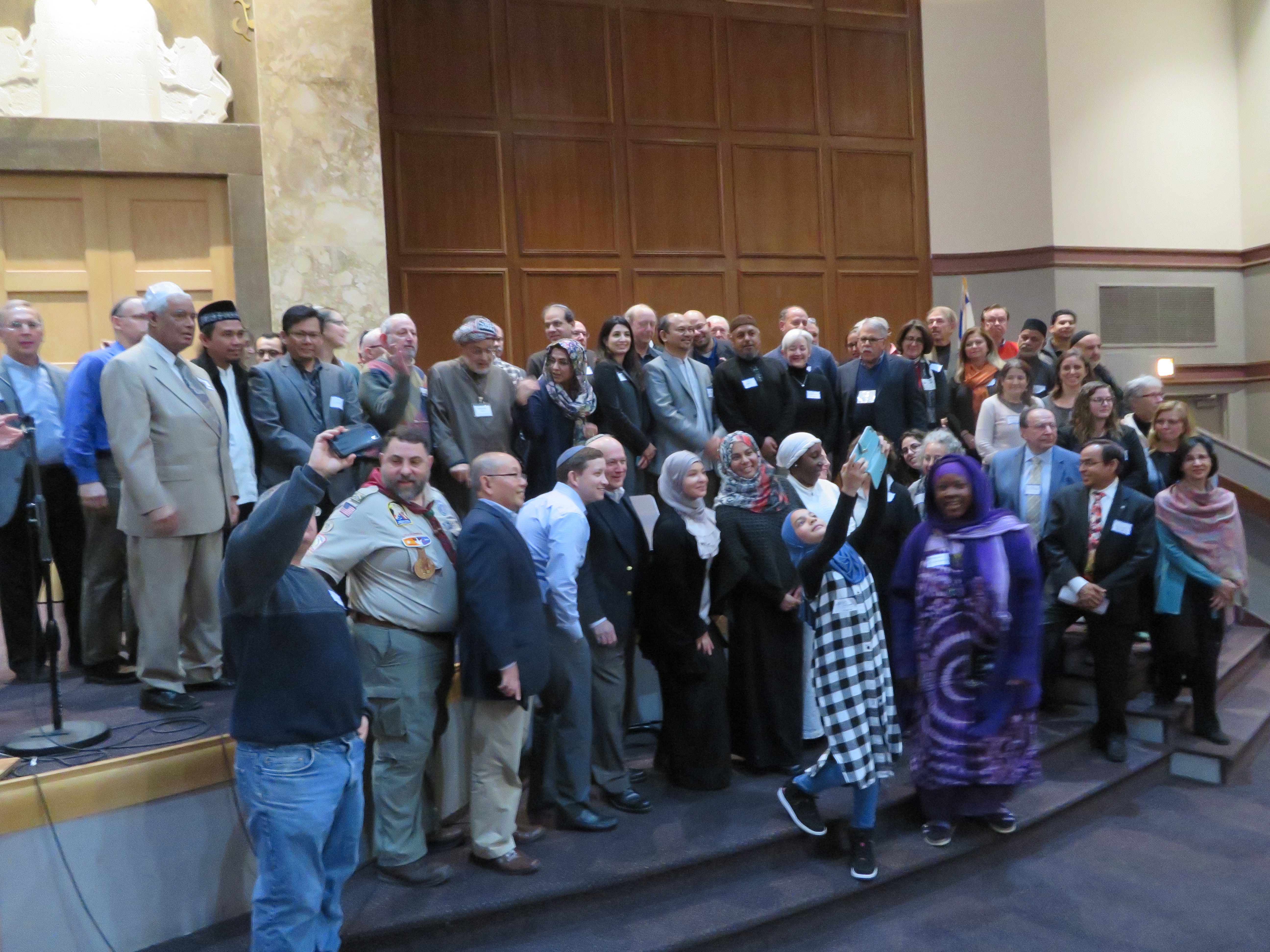 Imams, rabbis, and Jewish and Muslim lay leaders pose for a group photo at Congregation Tifereth Israel in Washington, D.C., Dec. 11, 2016. (Ron Kampeas)