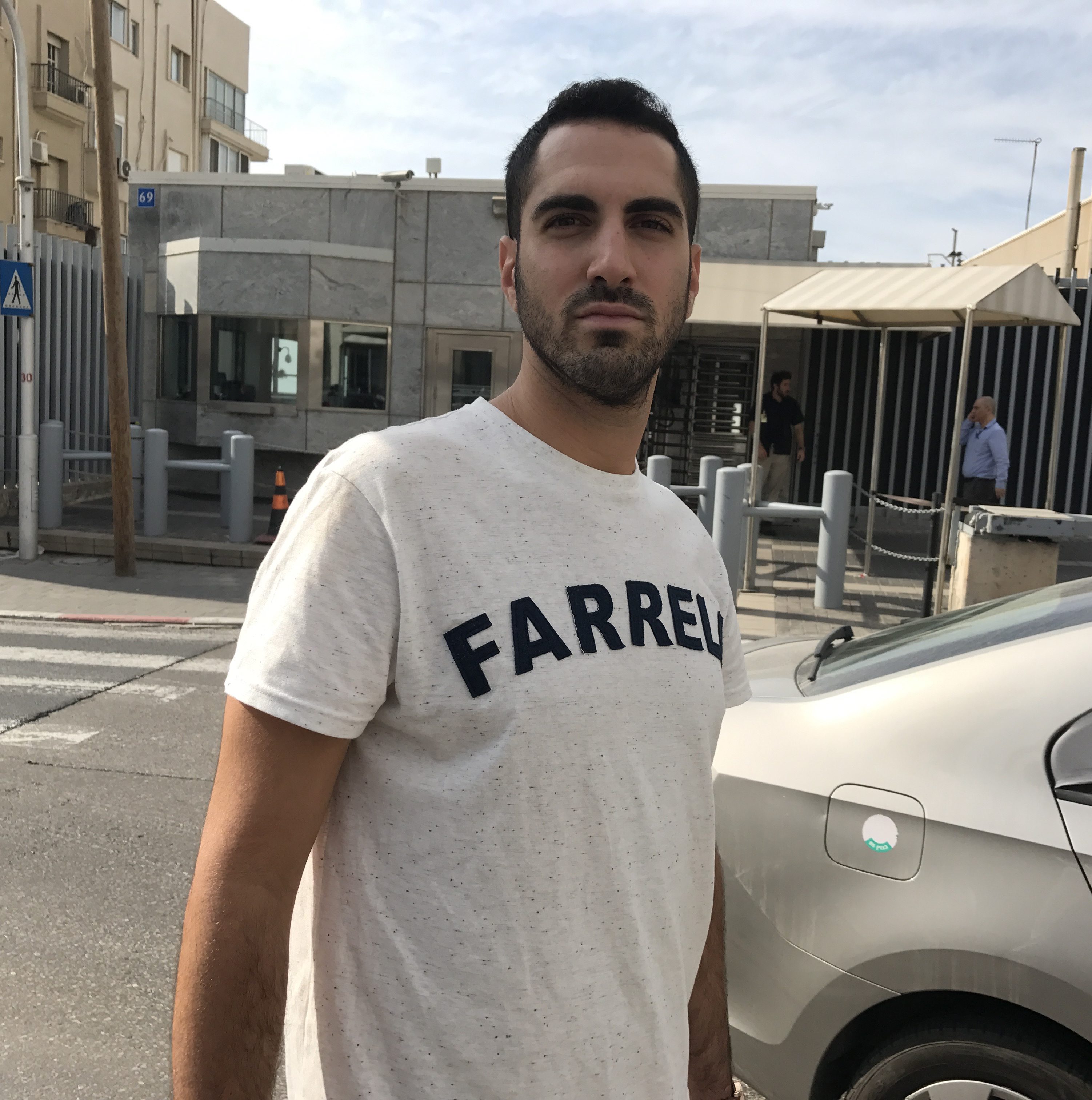 Haim Levy stands across the street from the U.S. Embassy in Tel Aviv, Nov. 14, 2016. (Andrew Tobin)