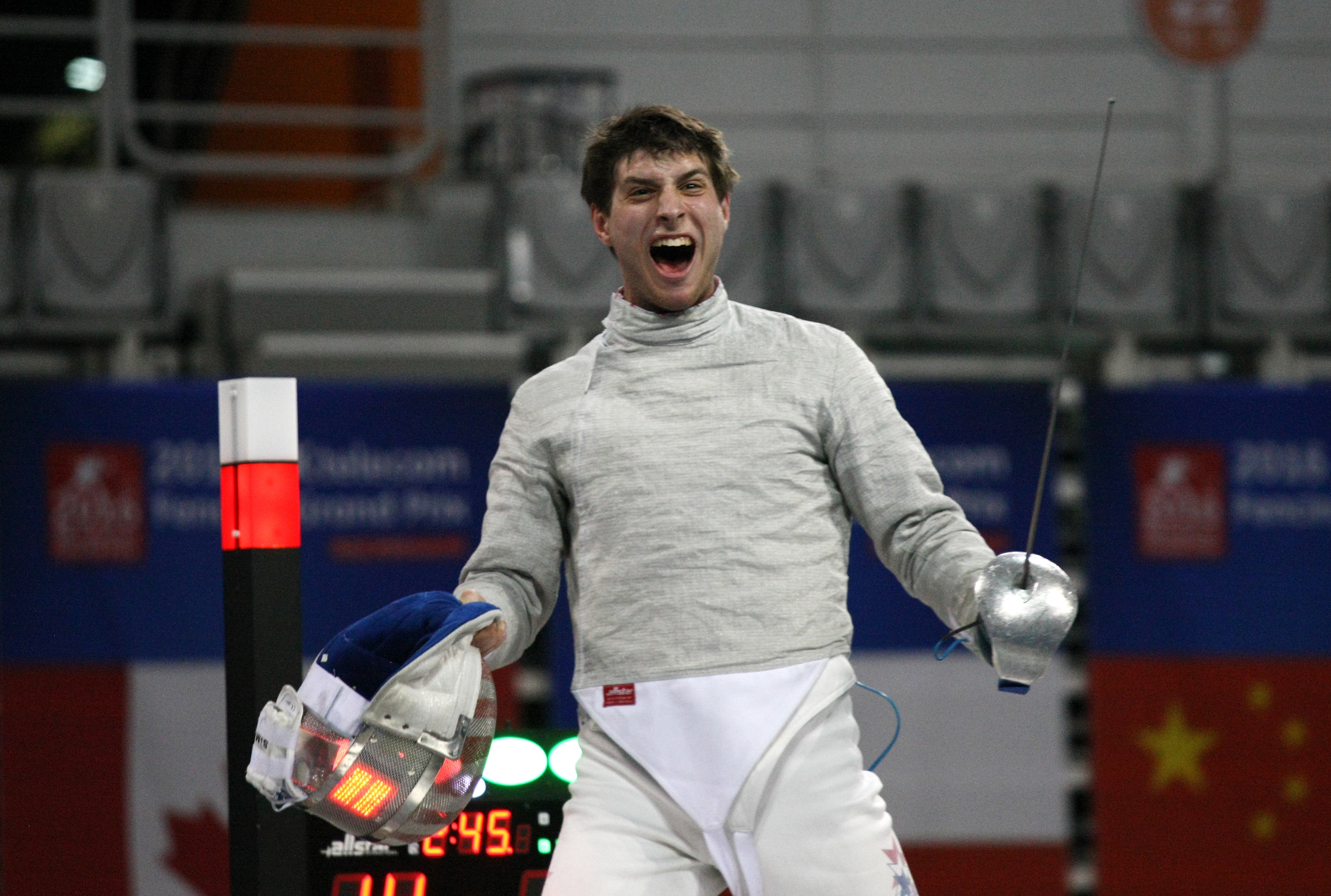 Eli Dershwitz of the USA celebrates victory over Iran's Mojtaba Abedini in an FIE Grand Prix match in Seoul, South Korea, March 26, 2016. (Mark Deibert/FIE via Getty Images)