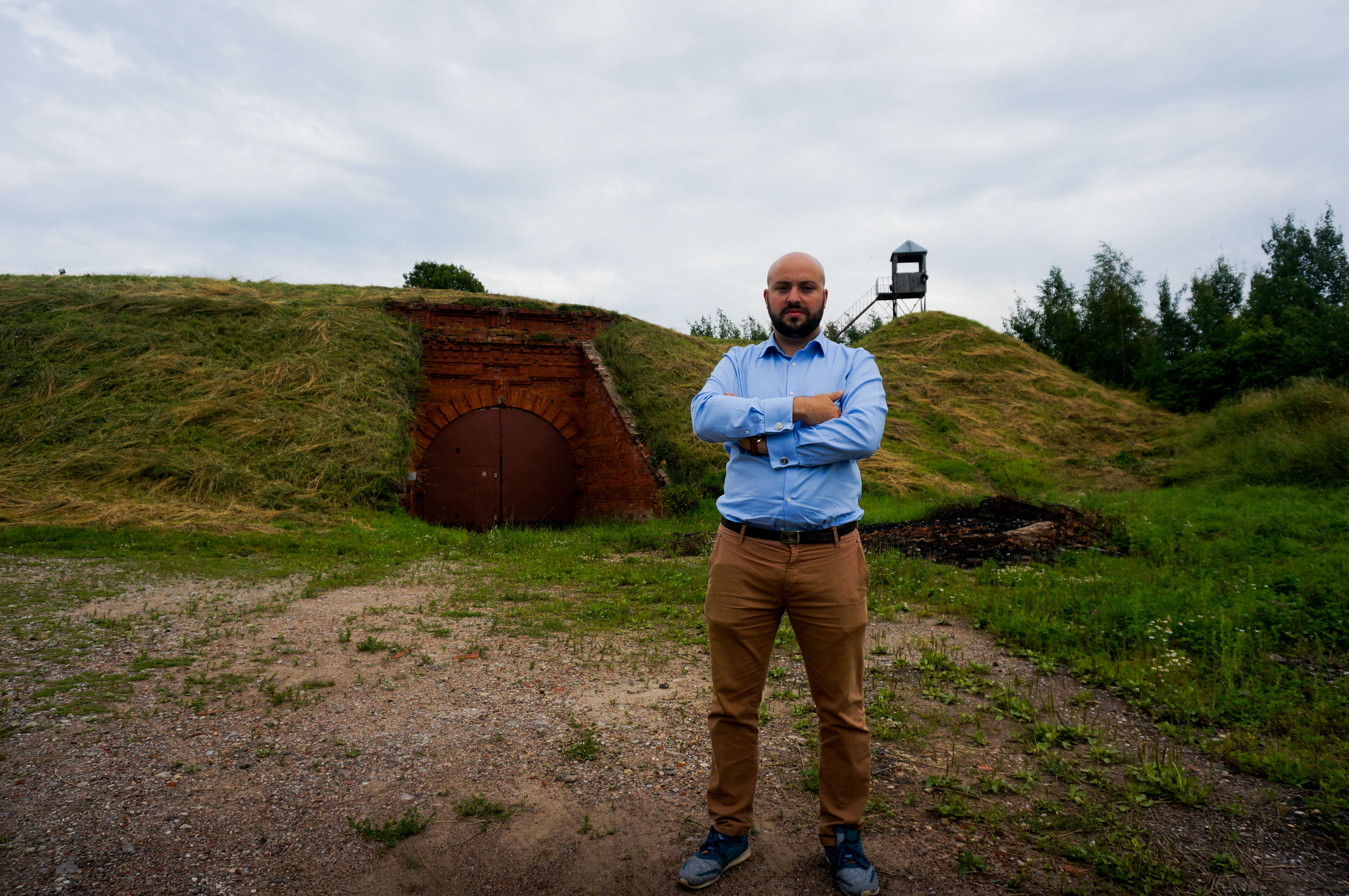 Jonny Daniels, founder of the Poland-based Holocaust commemoration group From the Depths, at the entrance to the Seventh Fort in Kaunas, Lithuania, July 12, 2016. (Cnaan Liphshiz)