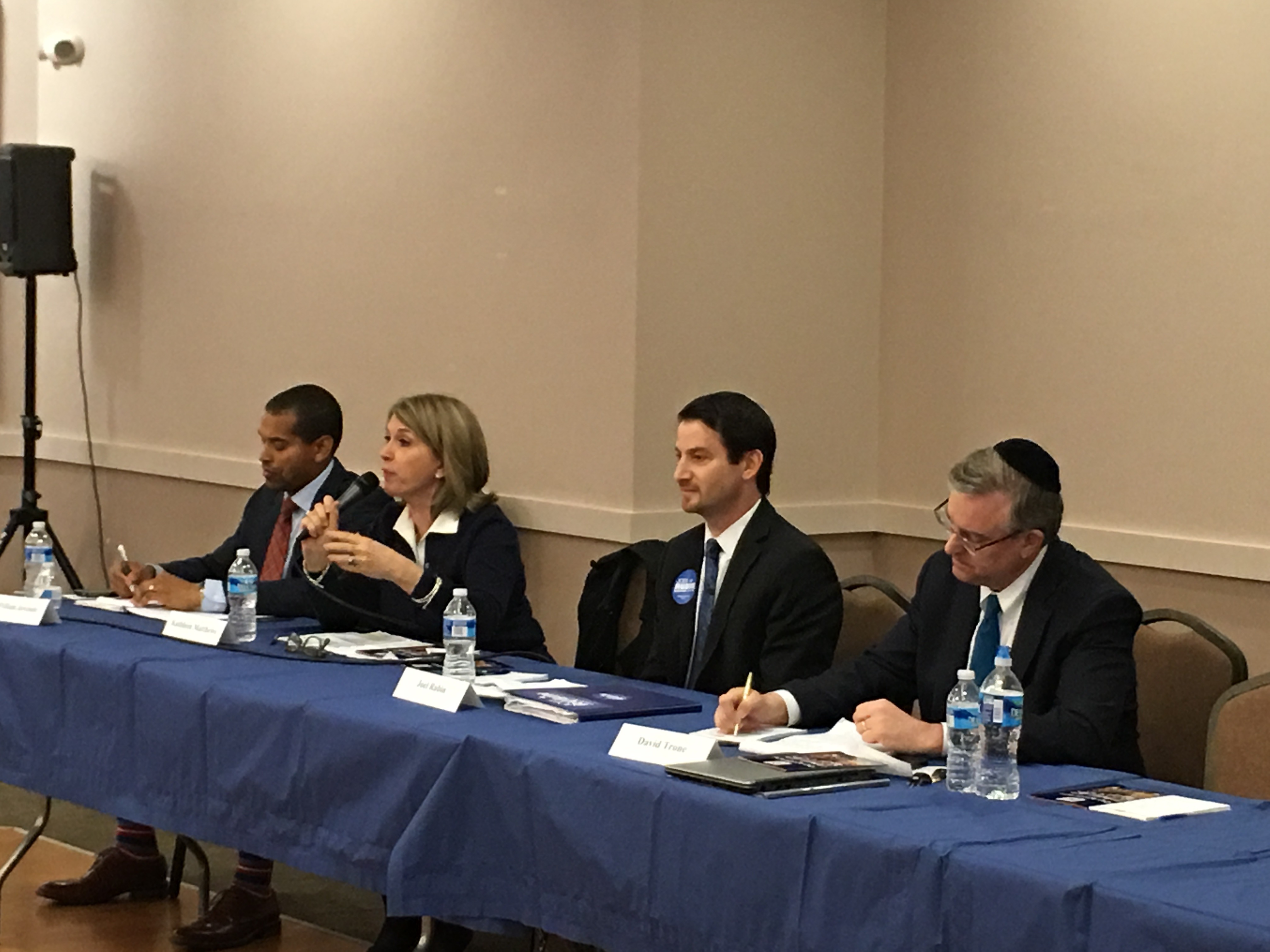 Left to right: Congressional candidates Will Jawondo, Kathleen Matthews, Joel Rubin and David Trone debating at the Kemp Mill synagogue in Silver Spring, Md., at an event convened by the Orthodox Union, April 8, 2016. (Ron Kampeas)