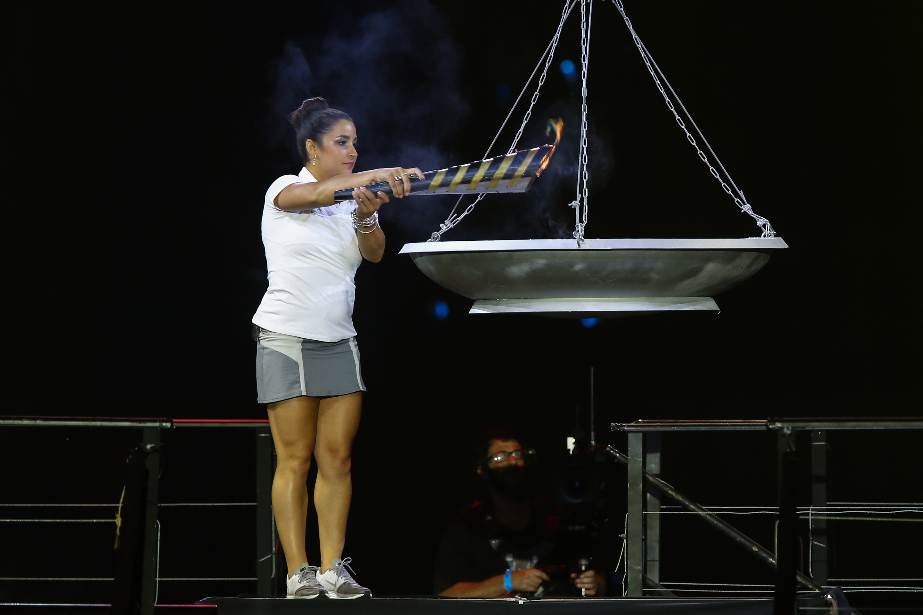 U.S. Olympic gymnast and gold medalist Aly Raisman lighting the torch during the opening ceremony of the 19th Maccabiah Games at Jerusalem’s Teddy Stadium, July 19, 2013. (Yonatan Sindel/Flash90/JTA)