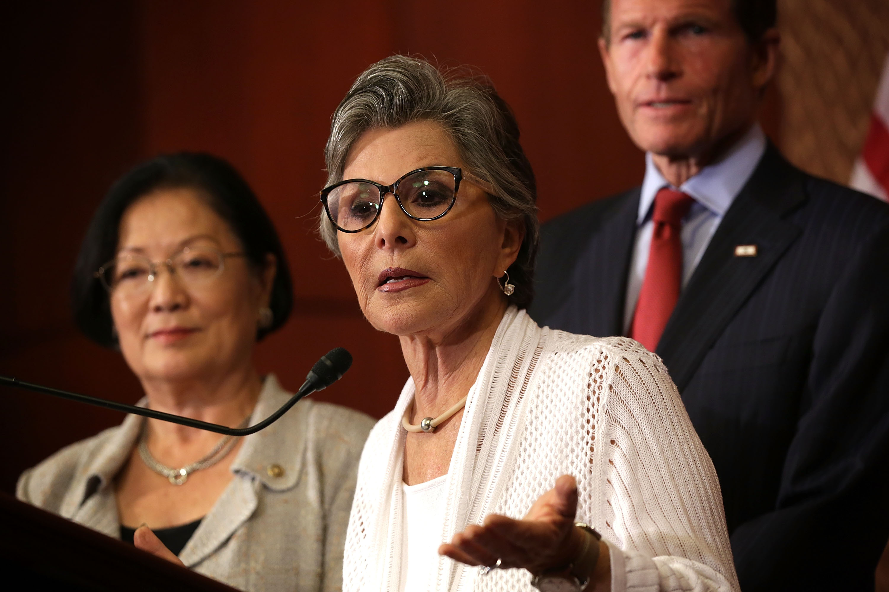 Sen. Barbara Boxer speaking at a news conference in Washington, D.C., with Sen. Richard Blumenthal in the background, Aug. 3, 2015. (Alex Wong/Getty Images)