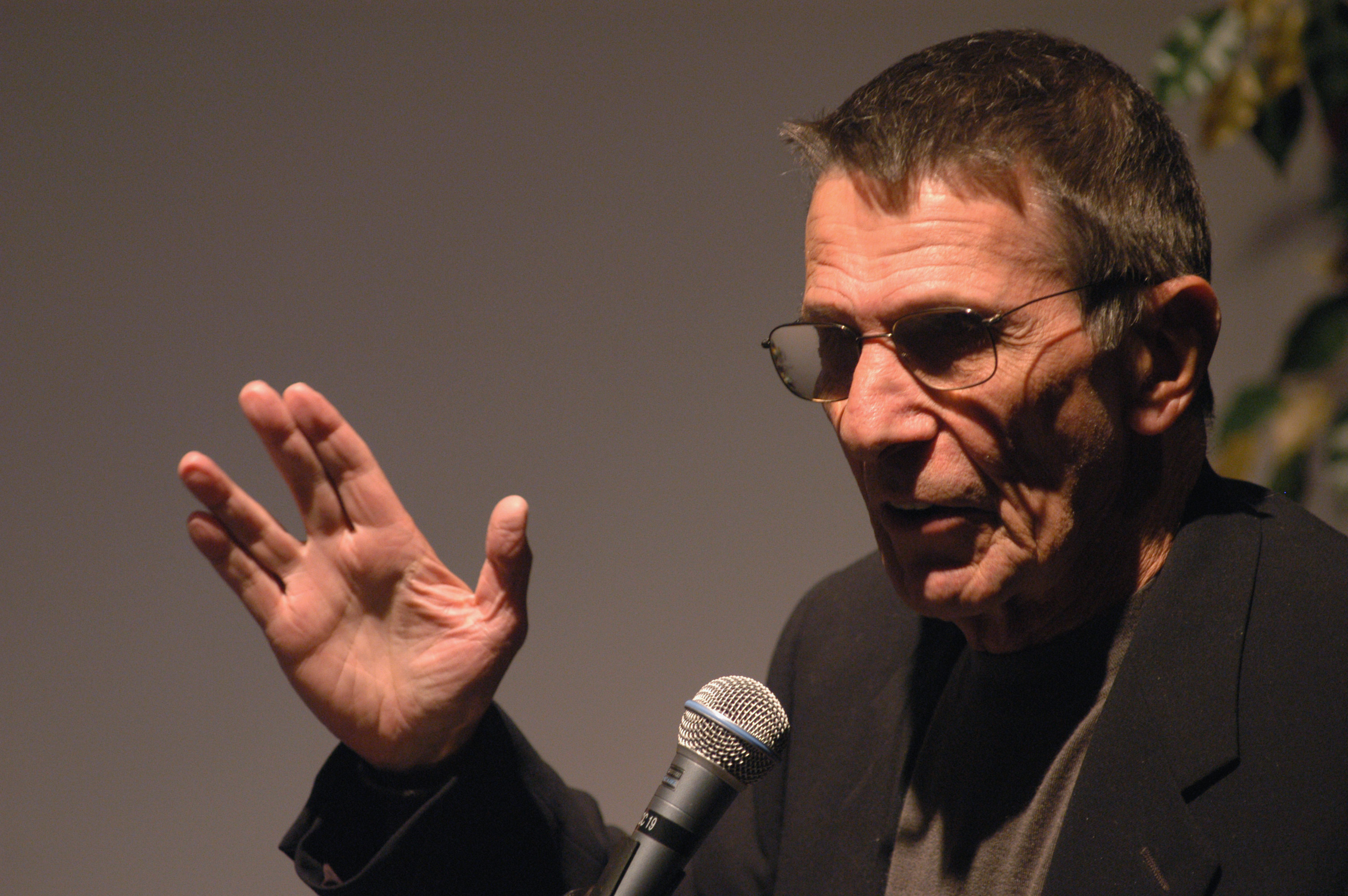 Leonard Nimoy, shown in 2002, demonstrating Spock's Vulcan salute devised from a Jewish prayer. (Michel Boutefeu/Getty Images)