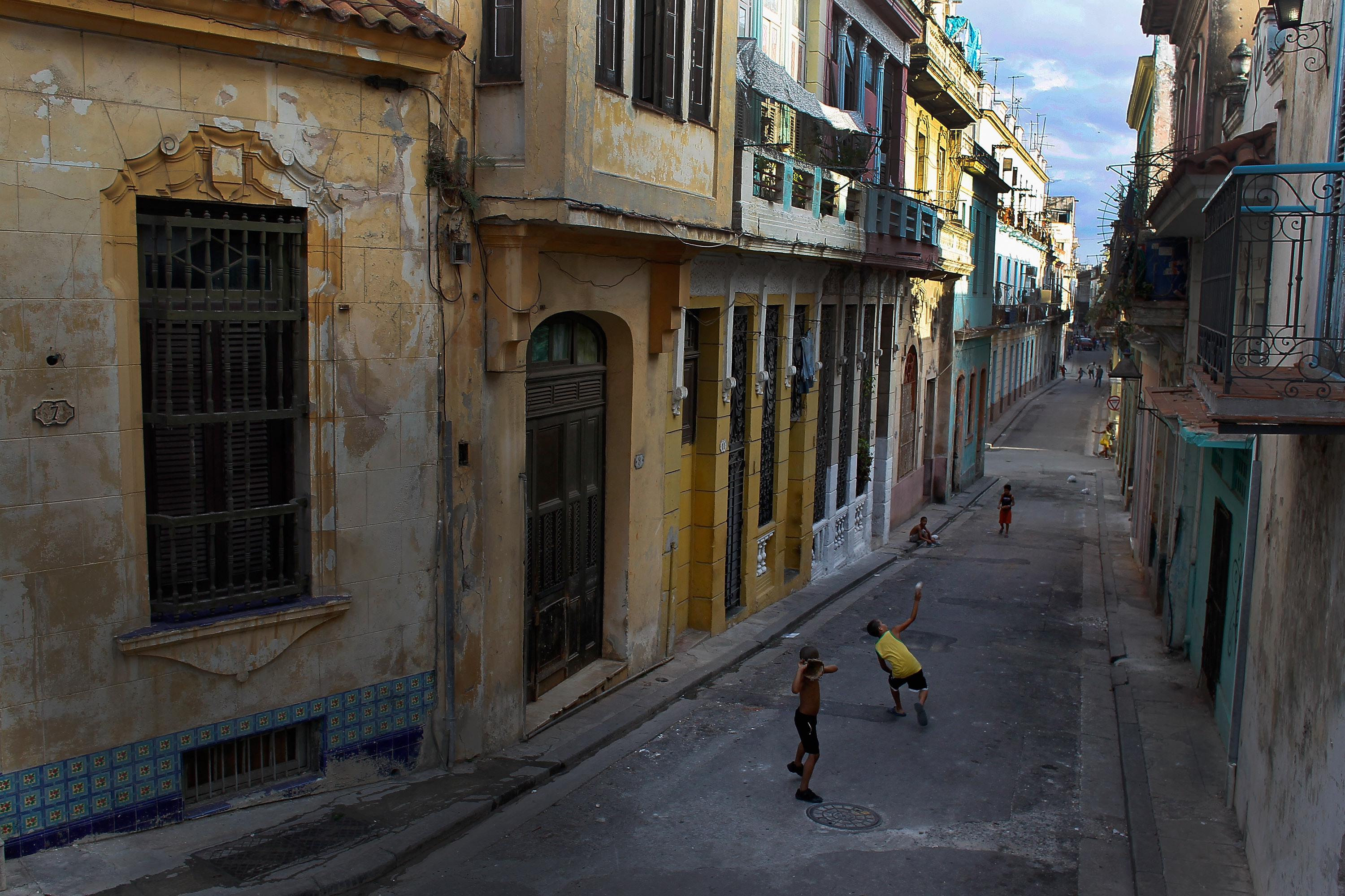 Children playing a baseball game in the streets of Havana. "For the baseball purists, those who love to go to Cuba, it's a unique culture," Kit Krieger says. (Joe Raedle/Getty Images)