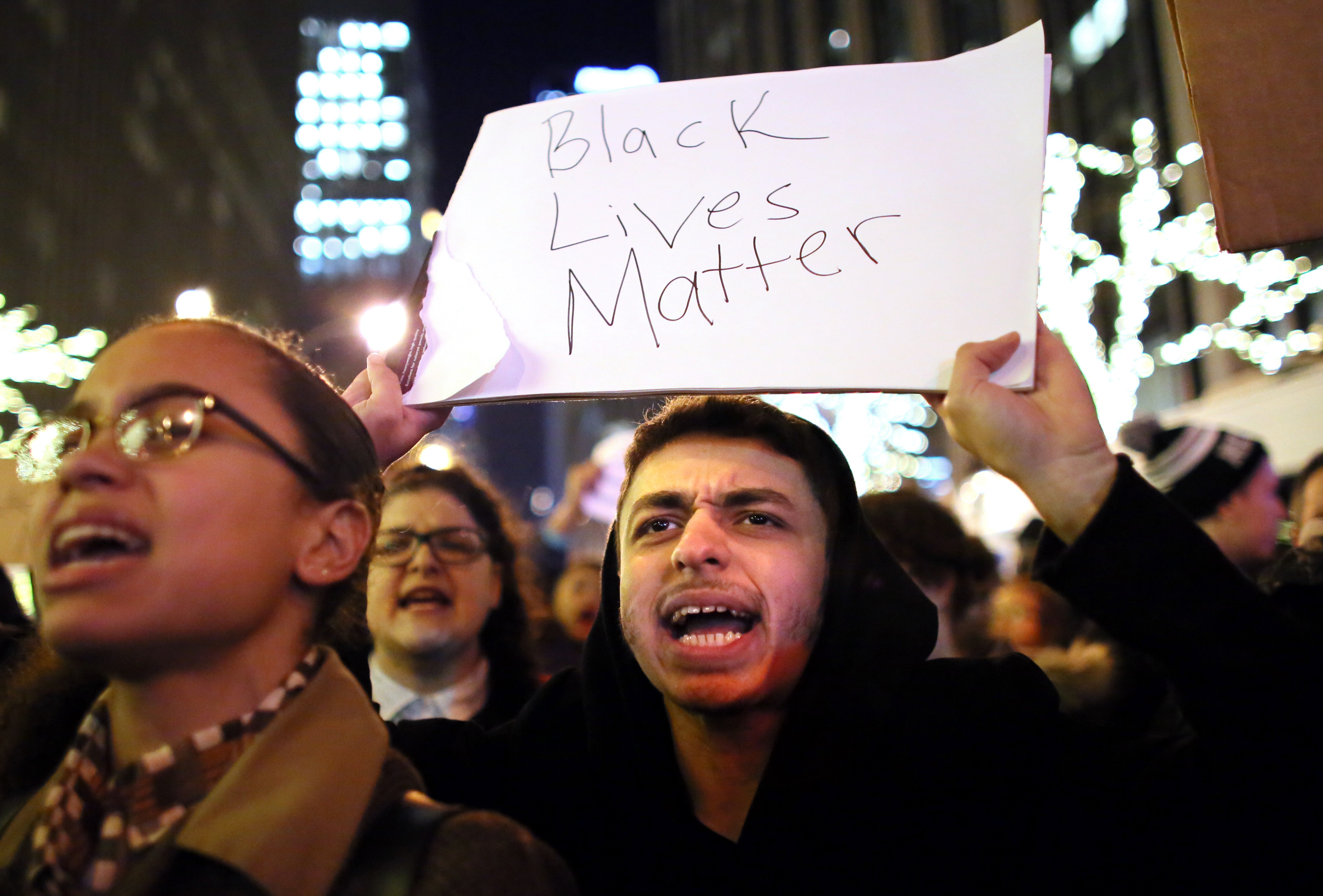 Demonstrators walk together during a protest Dec. 3, 2014 in New York. Protests began after a Grand Jury decided to not indict officer Daniel Pantaleo. Eric Garner died after being put in a chokehold on July 17, 2014. (Yana Paskova/Getty Images)