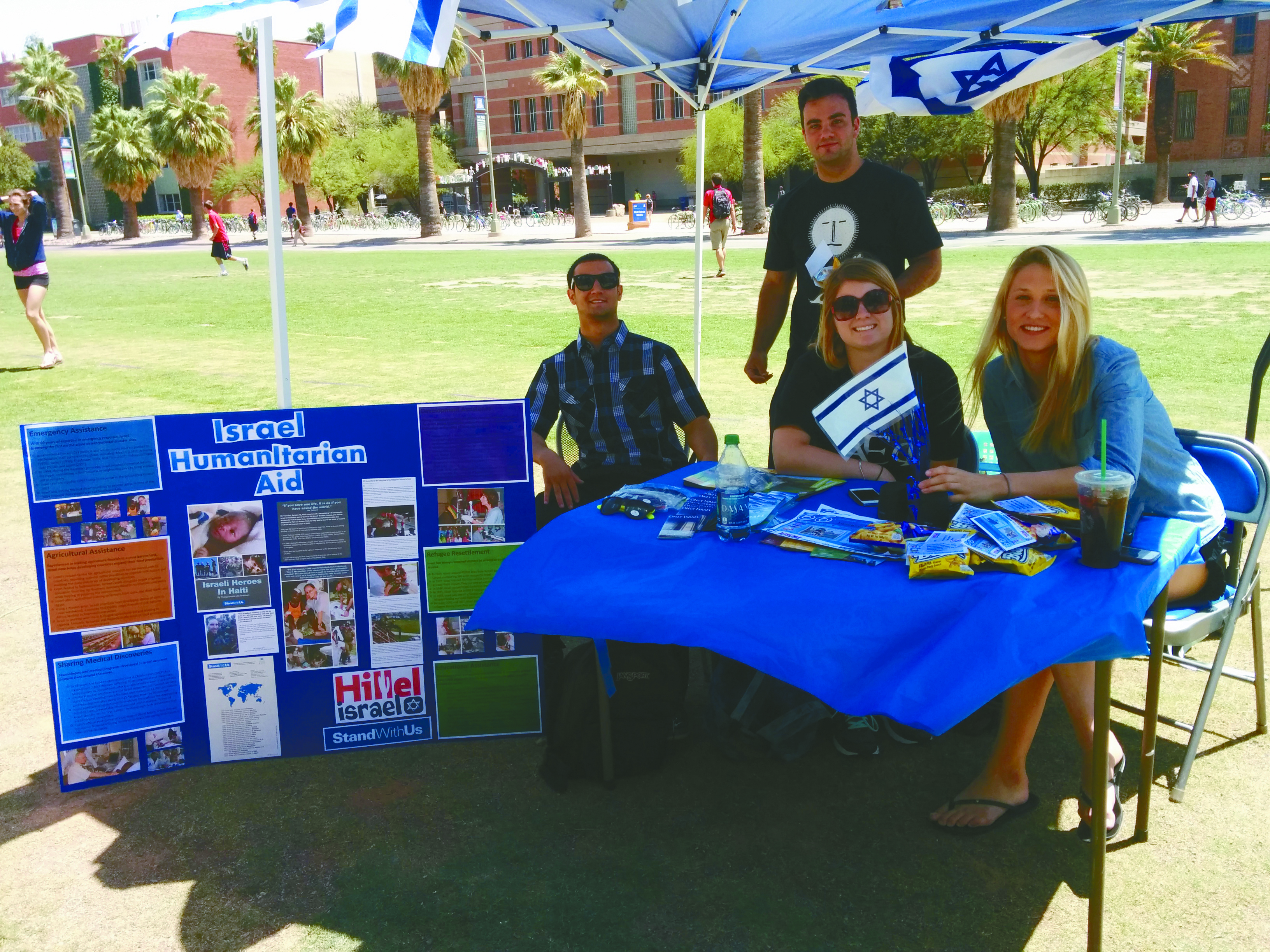 UA Hillel students (L-R) Michael Edmond, Aaron Bell, Edden Dembsky and Gavriela Fine manned a table on the UA mall to educate passers-by about Israeli humanitarian aid.