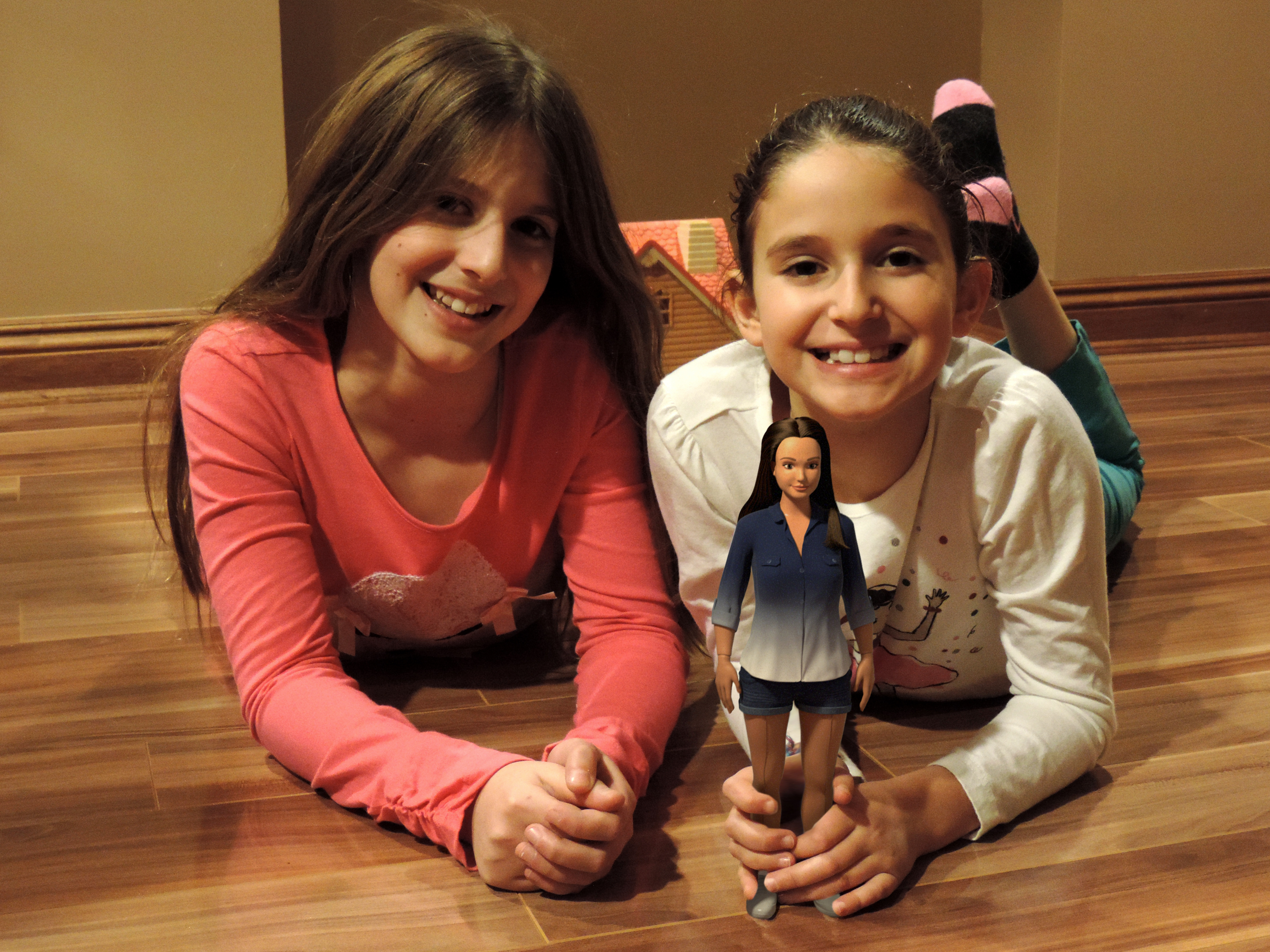 Nickolay Lamm's cousins play with a prototype of the Lammily doll. (Courtesy Nickolay Lamm)