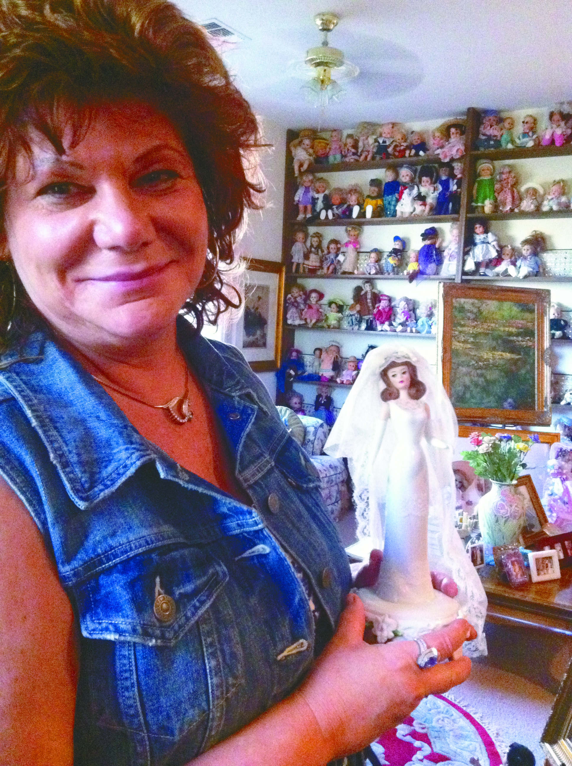 Arlene Barth with a few of the thousands of dolls in her collection (Renee Claire)