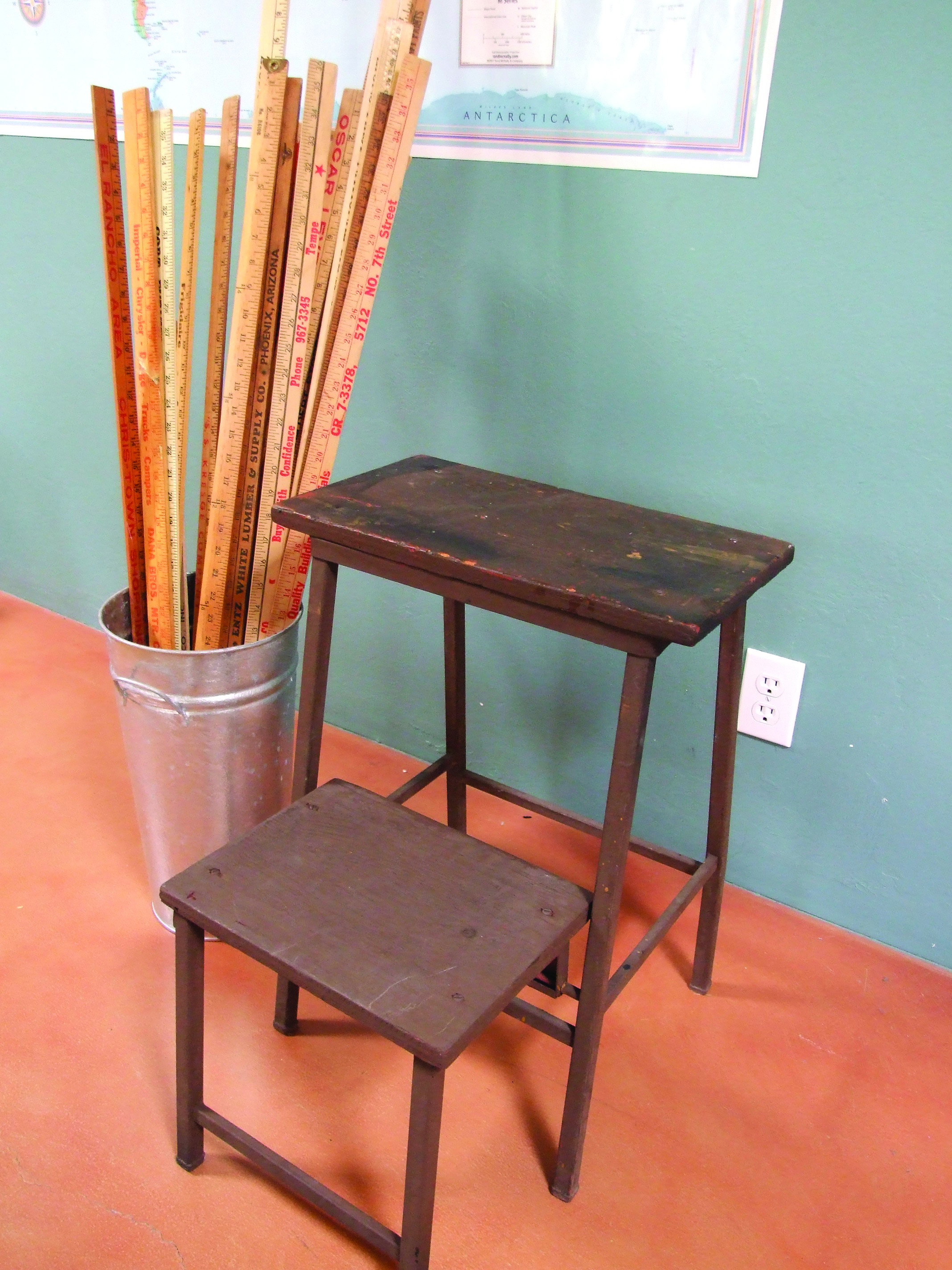 A slightly shabby vintage step stool is ready for a close-up in a hip decorating magazine ...