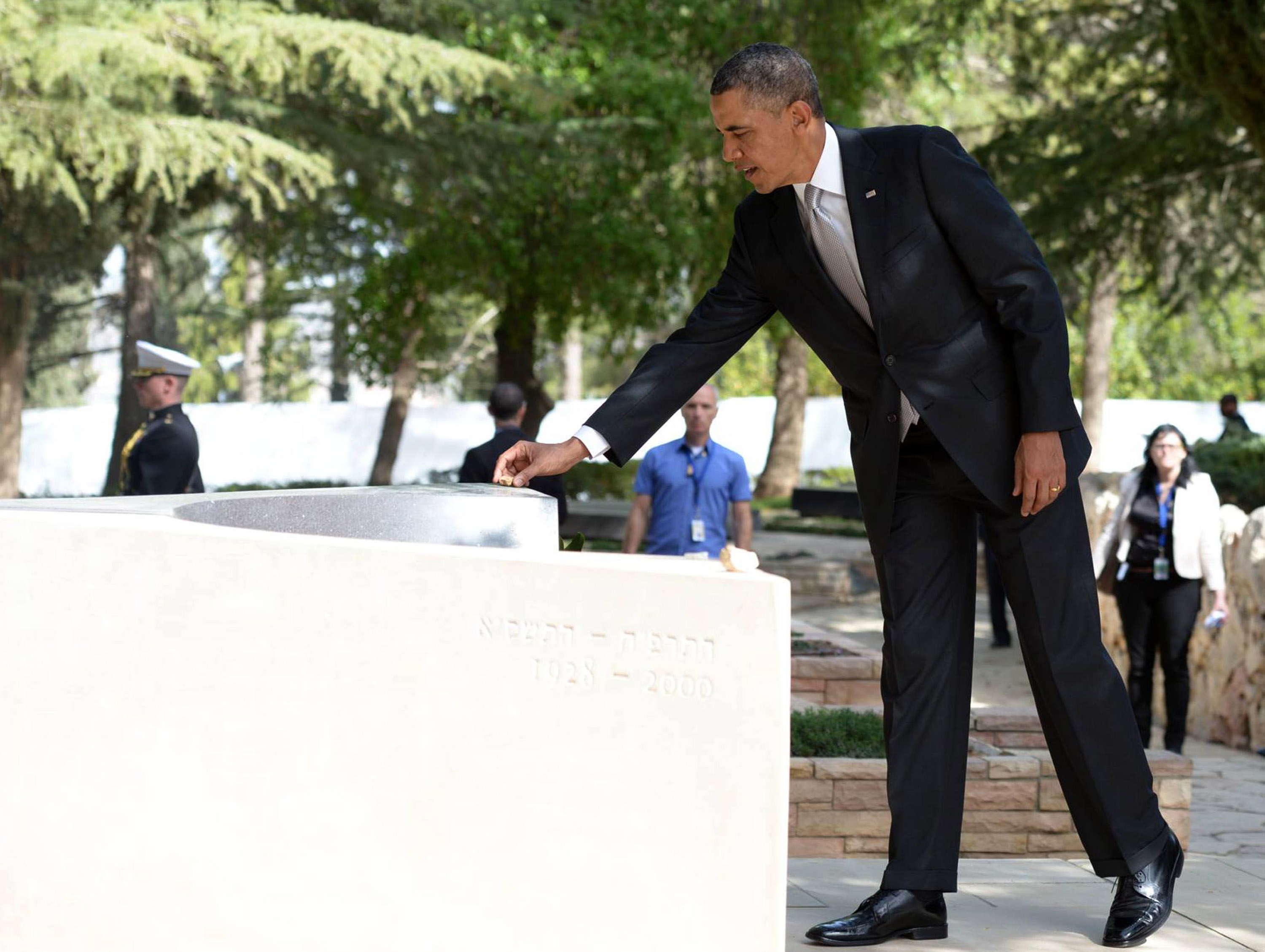 President Obama placing a stone on the headstone of Yitzhak and Leah Rabin during a visit to Mount Herzl in Jerusalem, March 22, 2013. (Mark Neyman/GPO/JTA)
